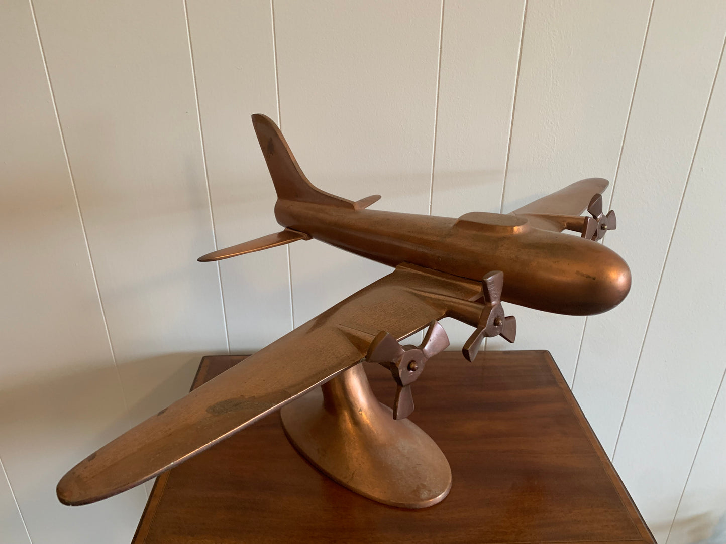A metal Copper plane ornament
