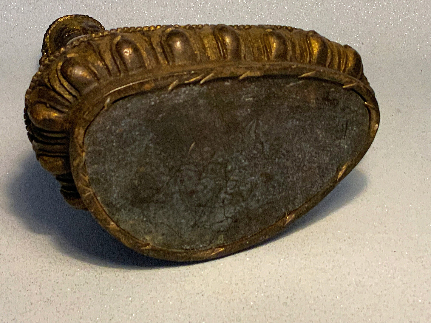 An antique bronze and gilt Buddha statue