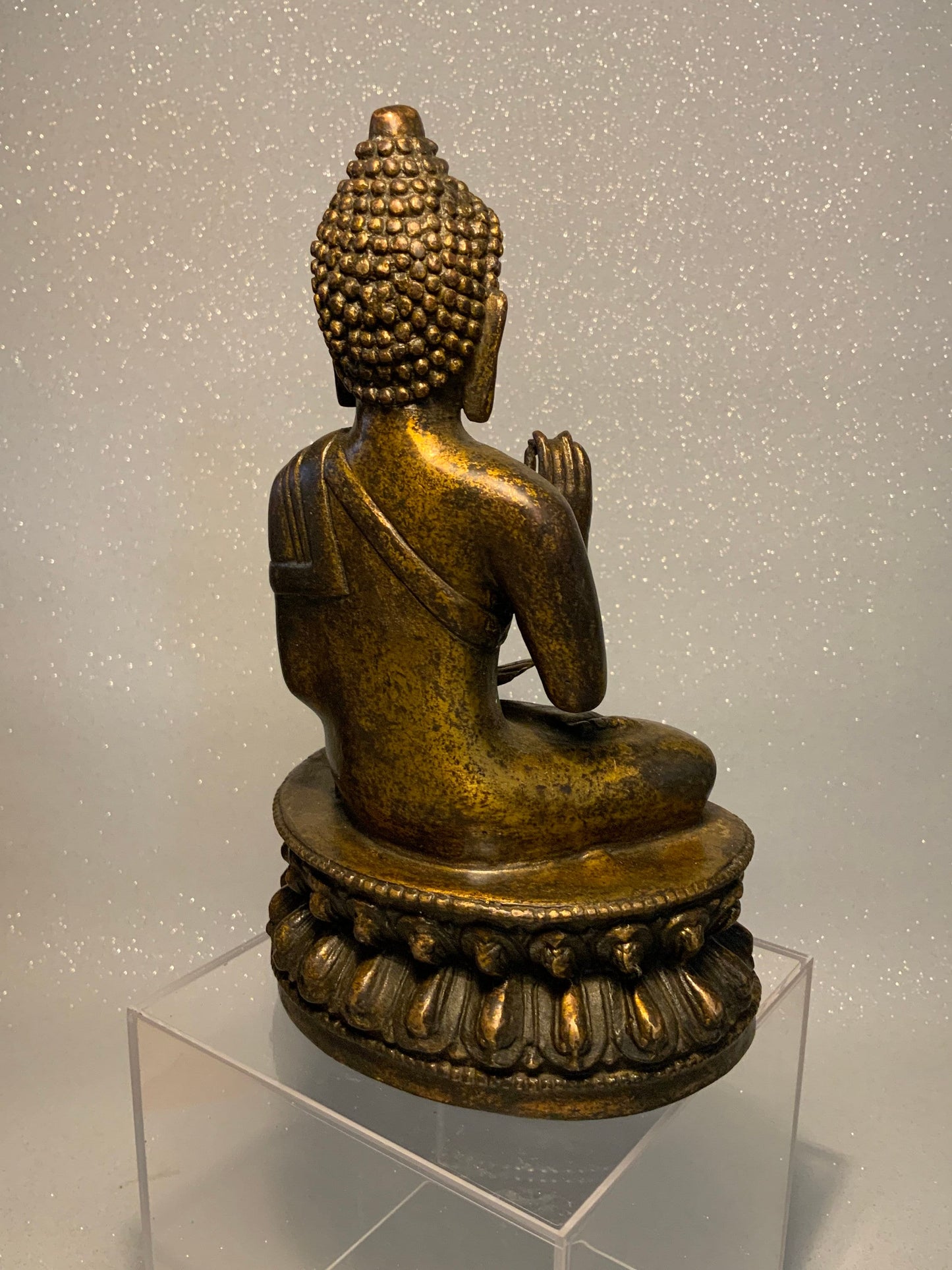 An antique bronze and gilt Buddha statue