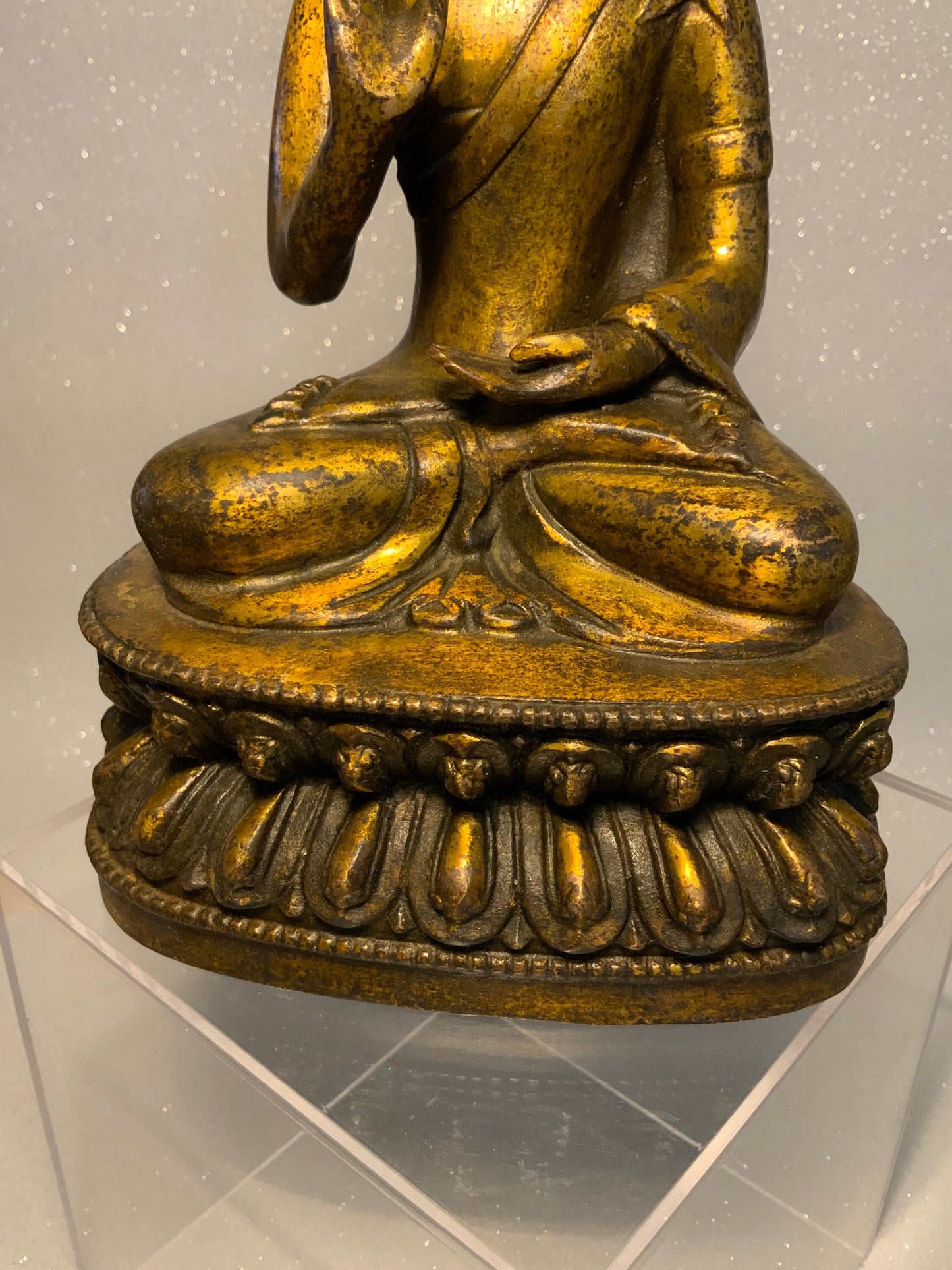 An antique bronze and gilt Buddha statue