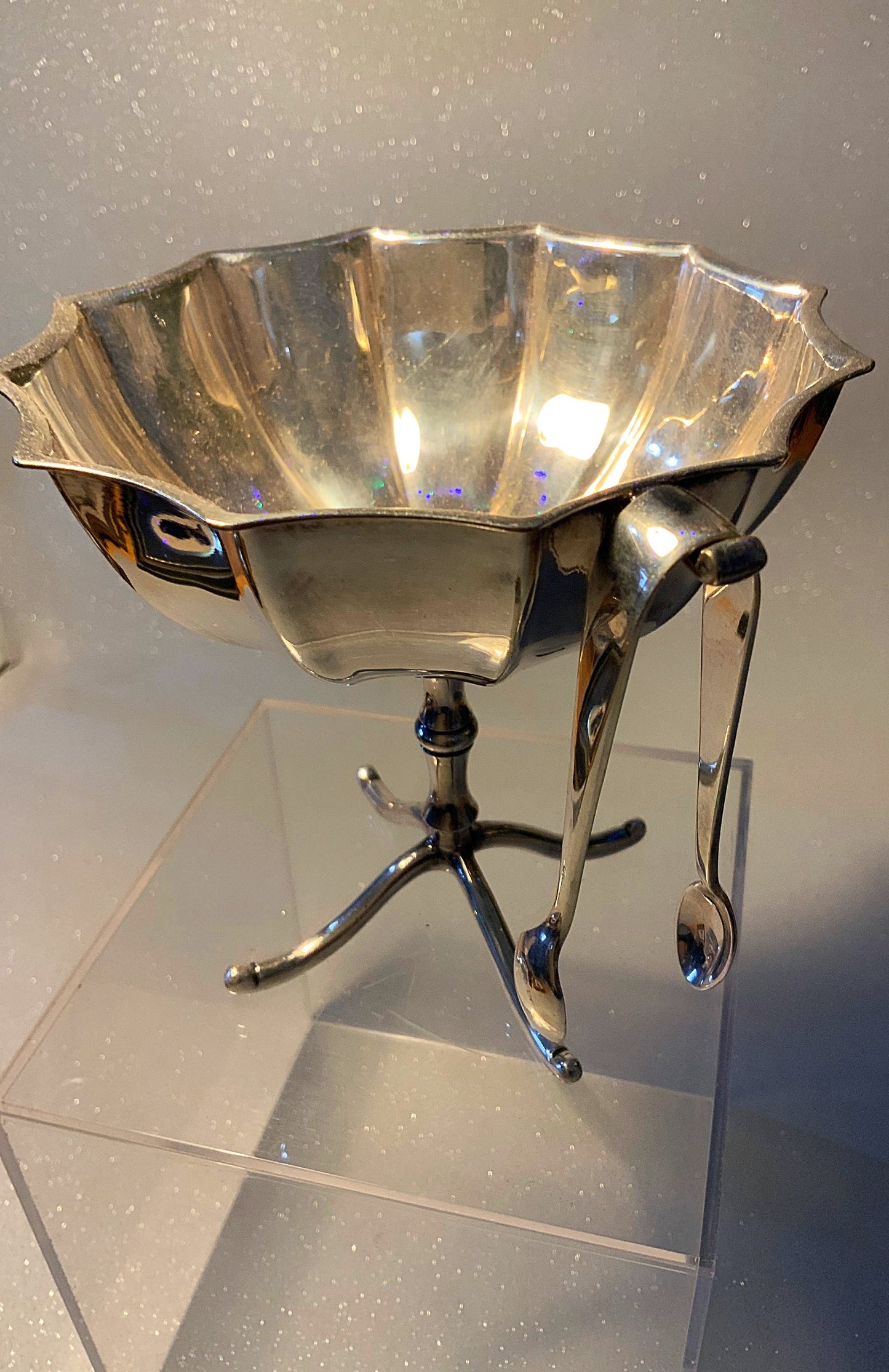A beautiful raised silver plated sugar bowl & tongs