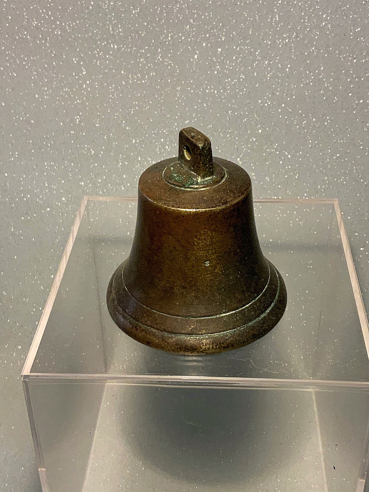 A small and authentic English antique bronze bell