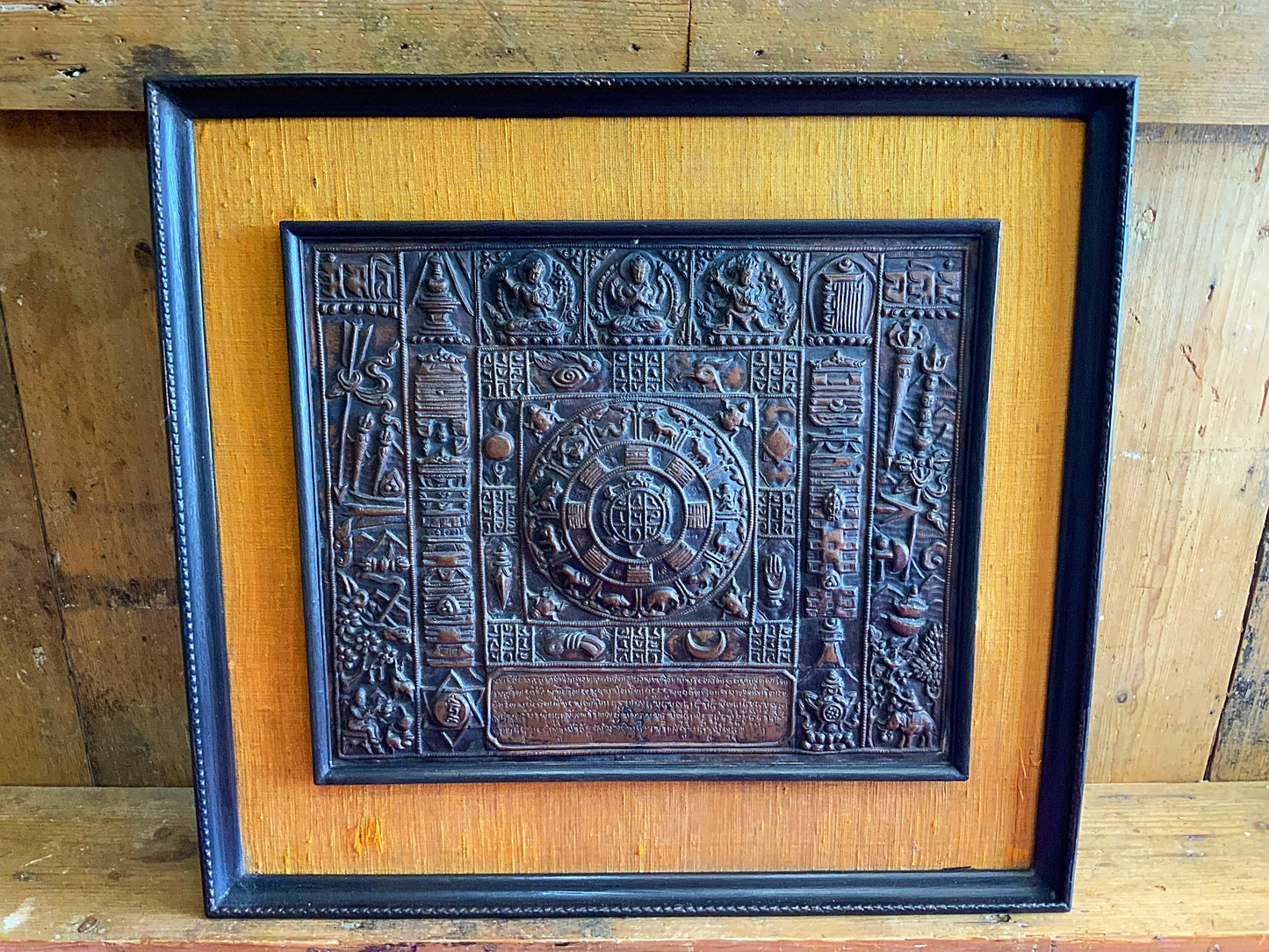 A stunning and framed Tibetan calendar