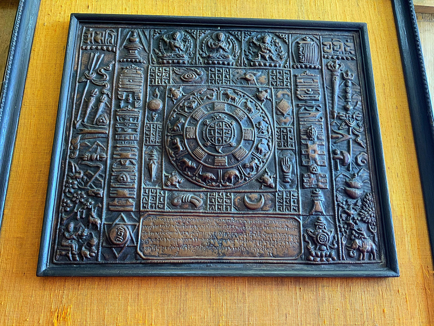 A stunning and framed Tibetan calendar