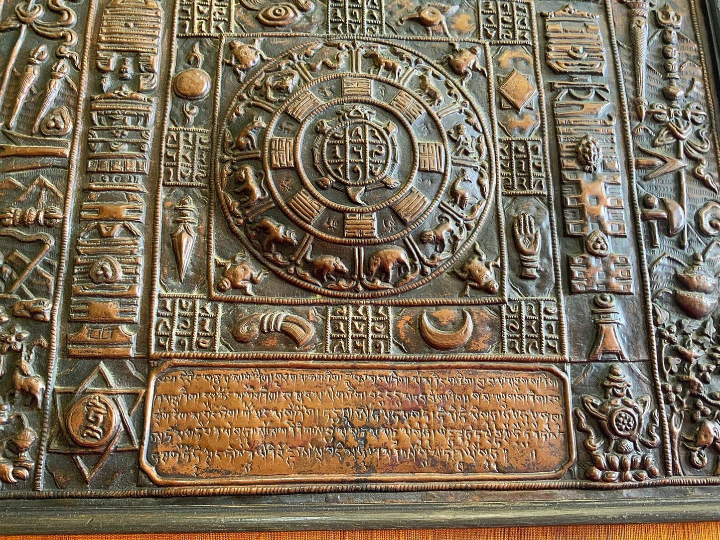 A stunning and framed Tibetan calendar