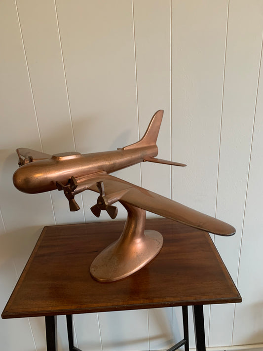 A metal Copper plane ornament