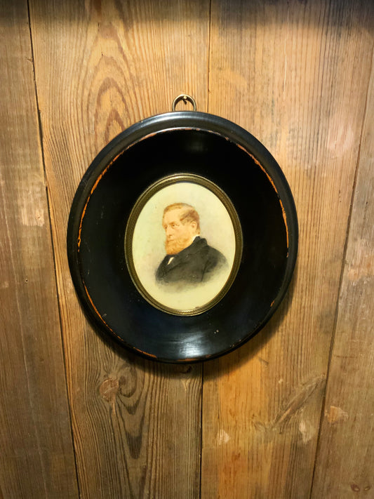 English antique oil in oval ebonised frame