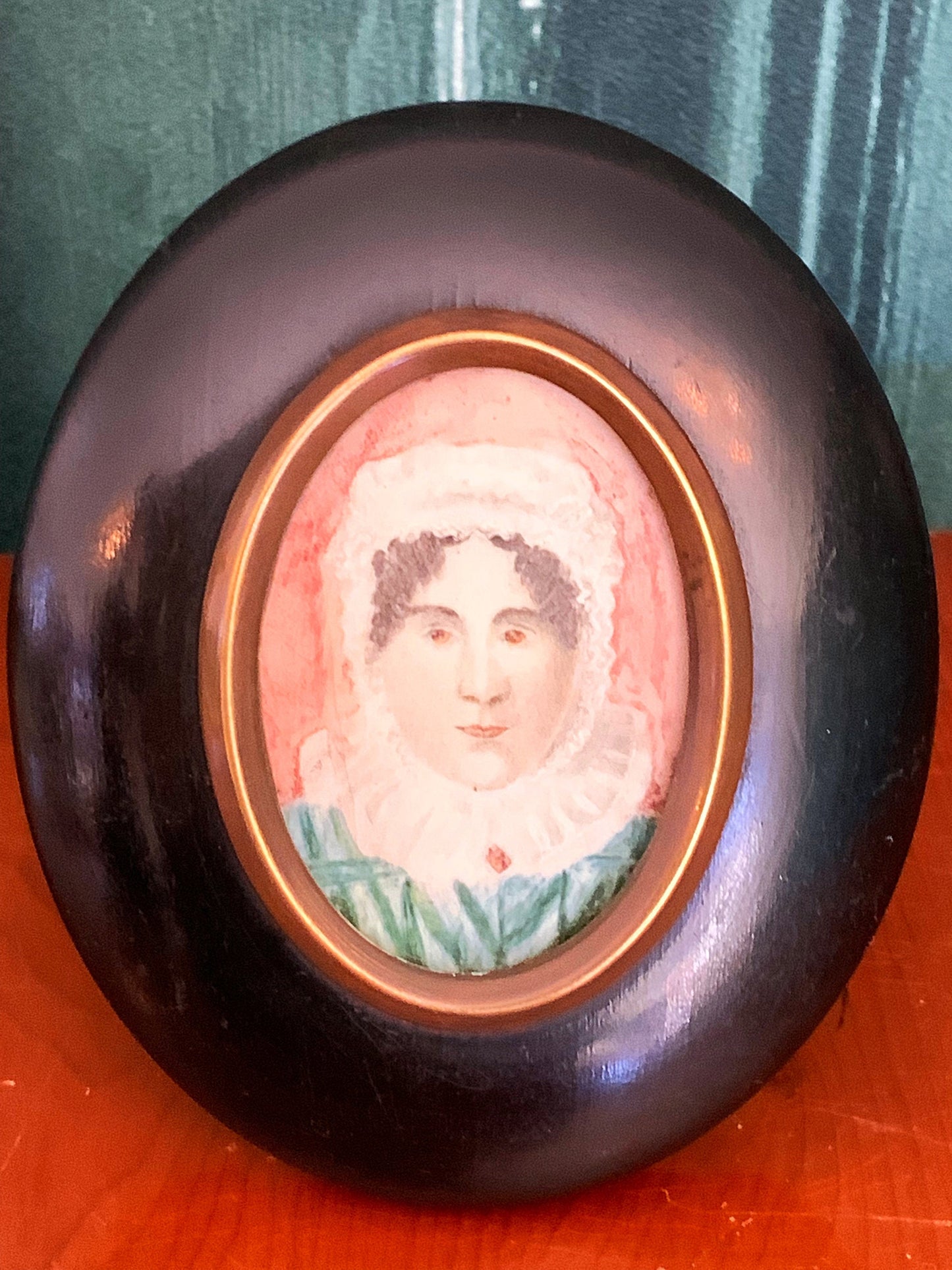 A beautiful antique hand painted miniature portrait