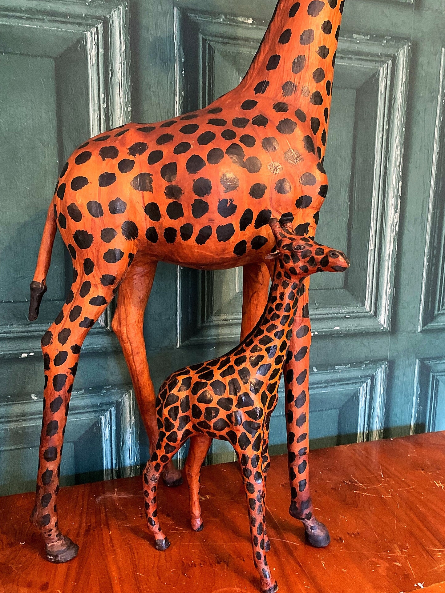 A stunning pair of leather giraffes