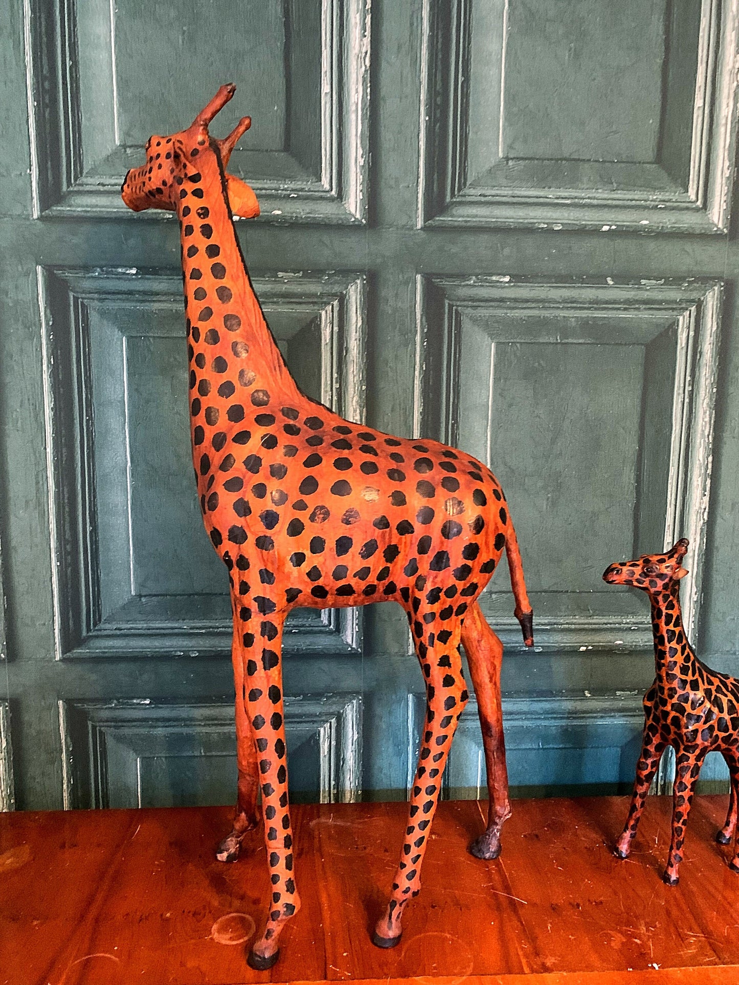 A stunning pair of leather giraffes