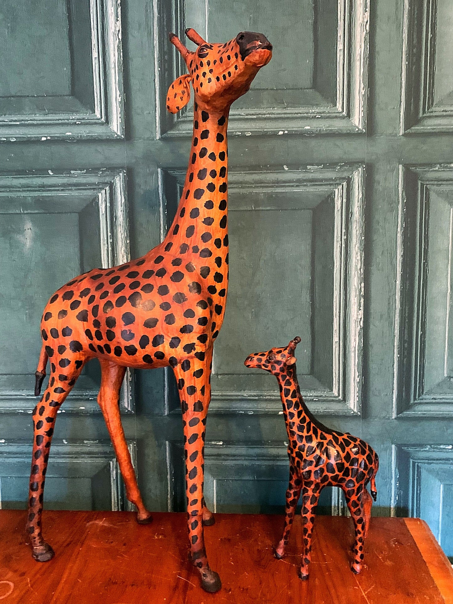 A stunning pair of leather giraffes