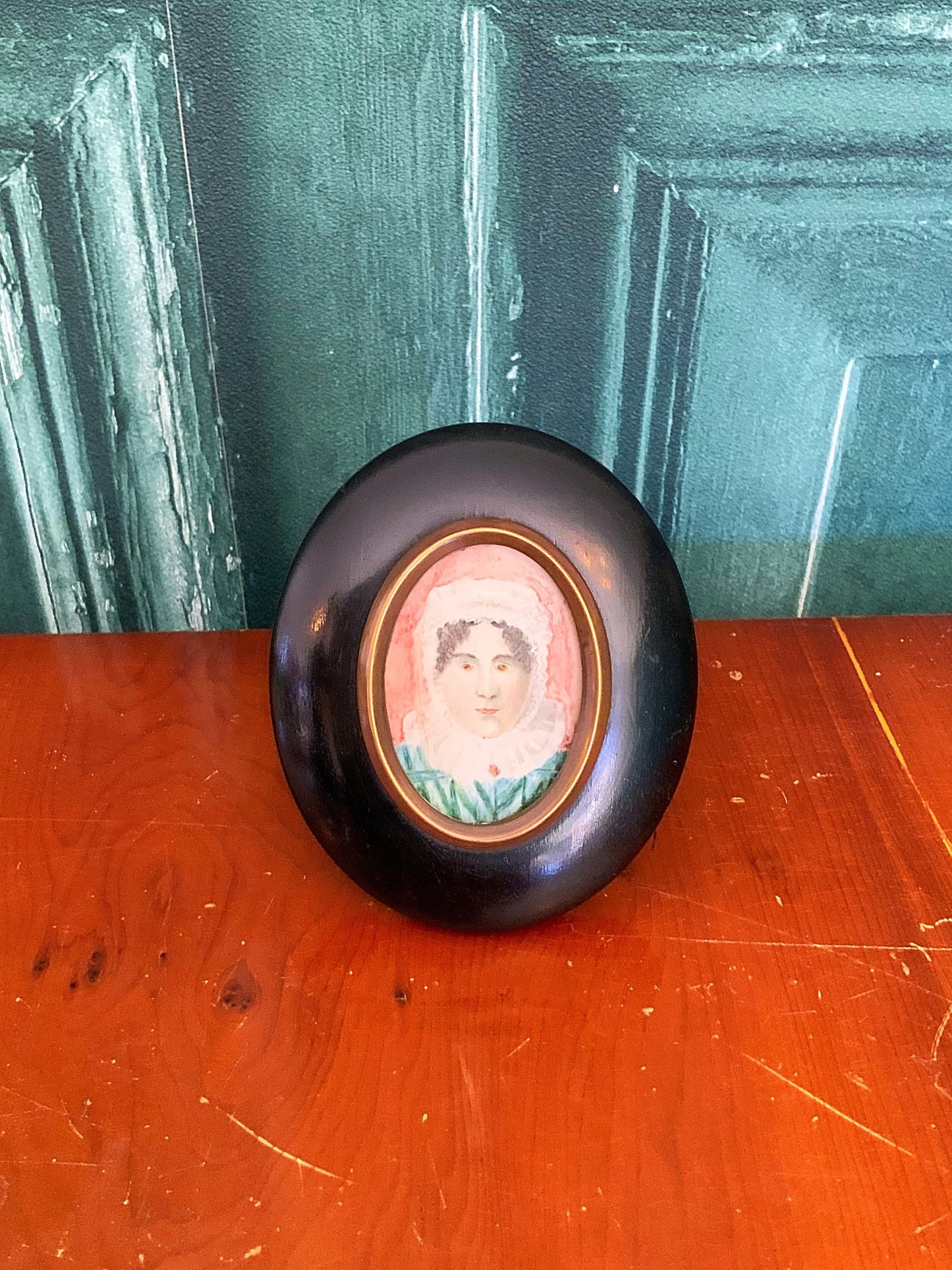 A beautiful antique hand painted miniature portrait