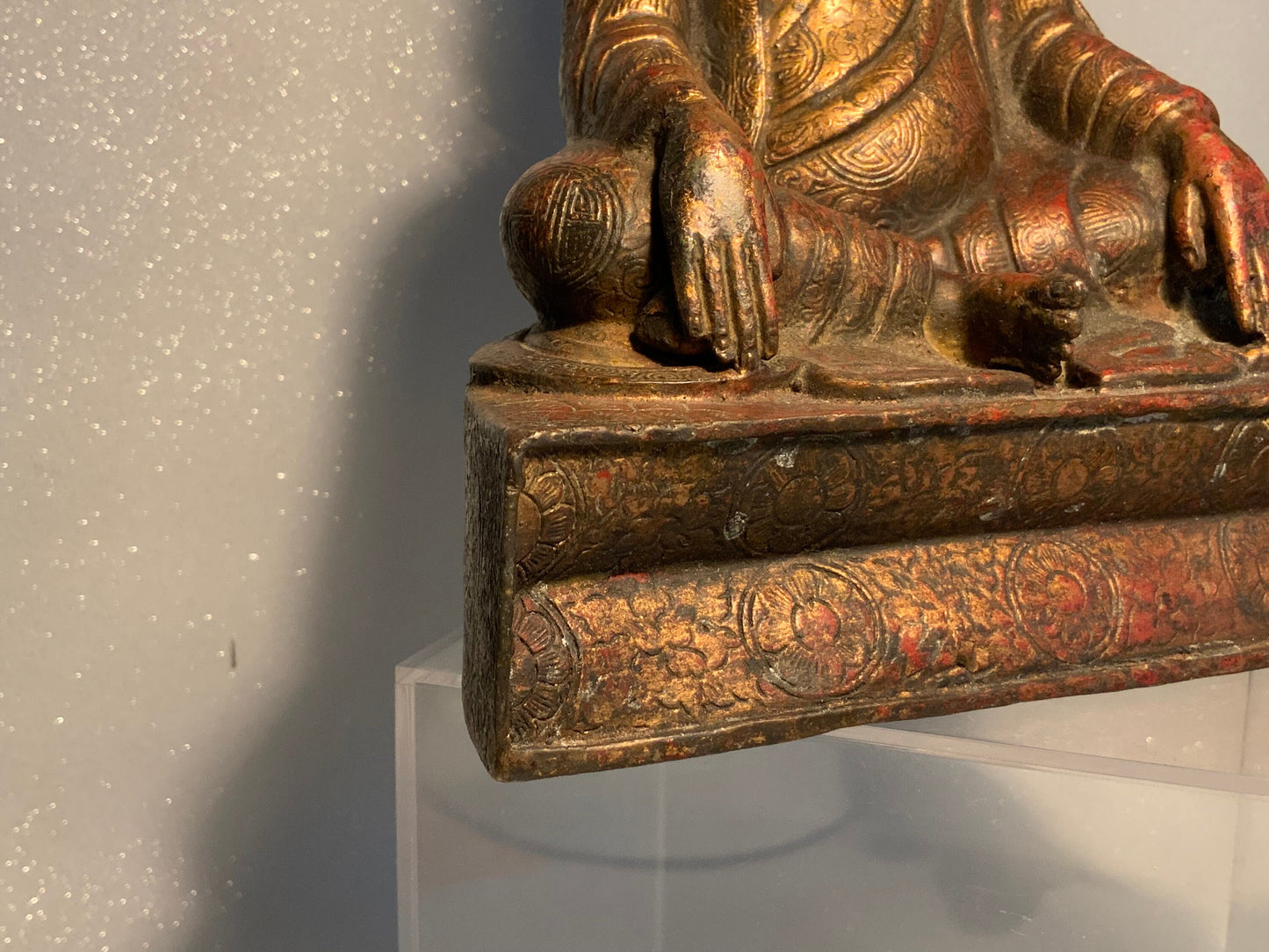 A antique bronze and gilt Buddha statue