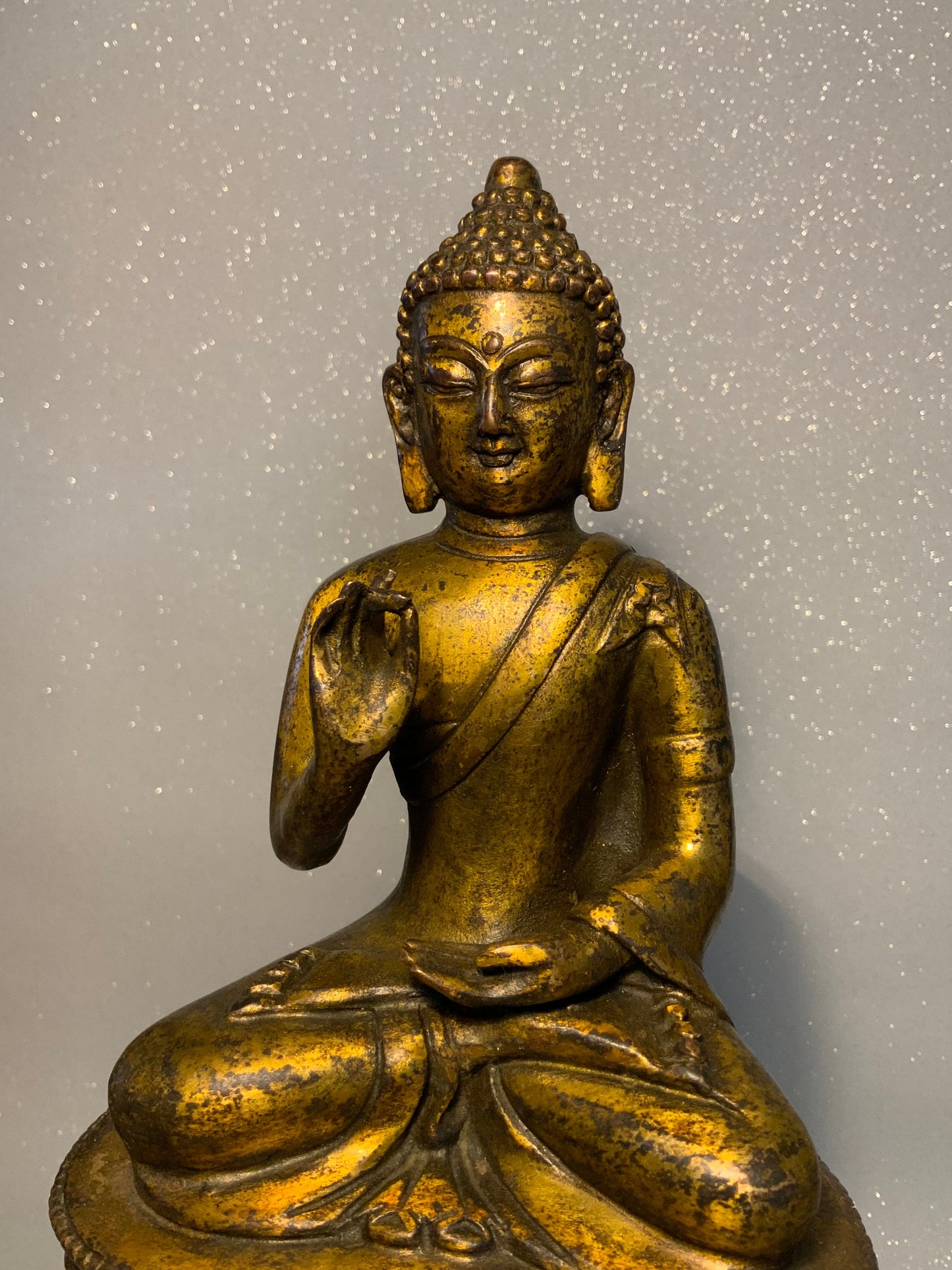 An  antique bronze and gilt Buddha statue