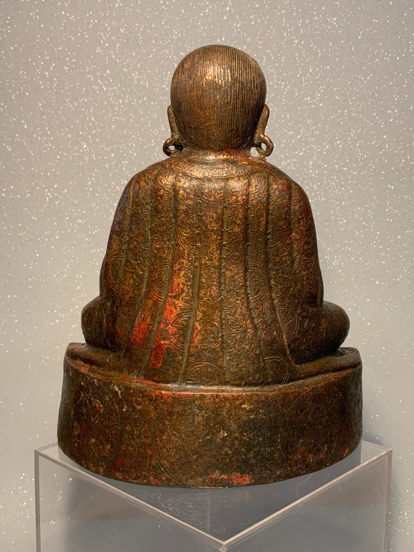 A antique bronze and gilt Buddha statue