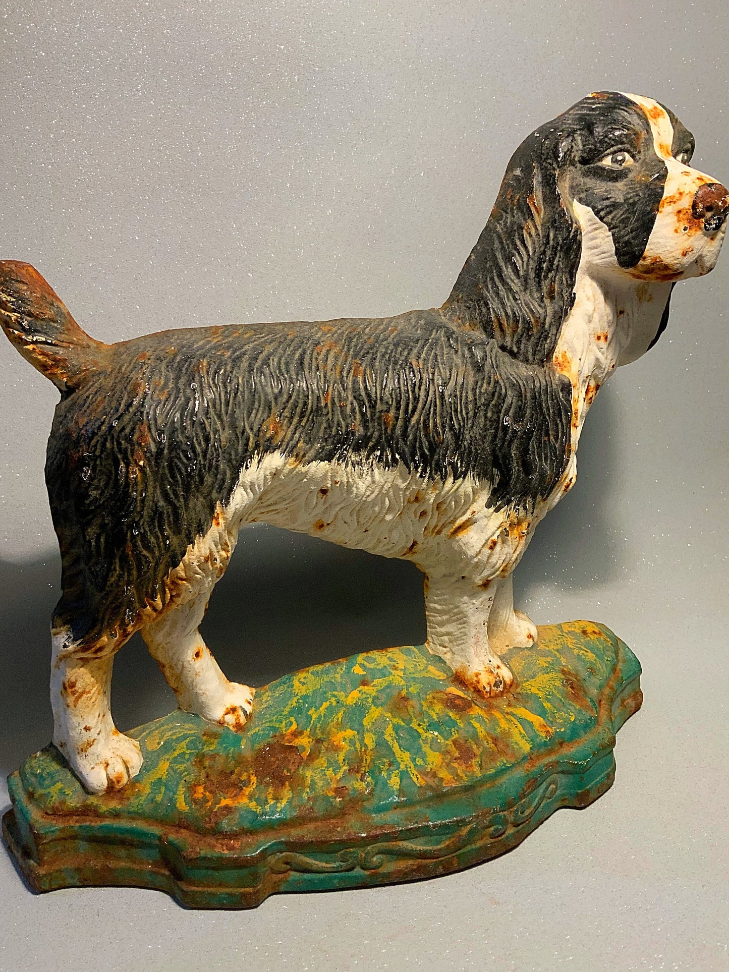 A super antique dog door stop