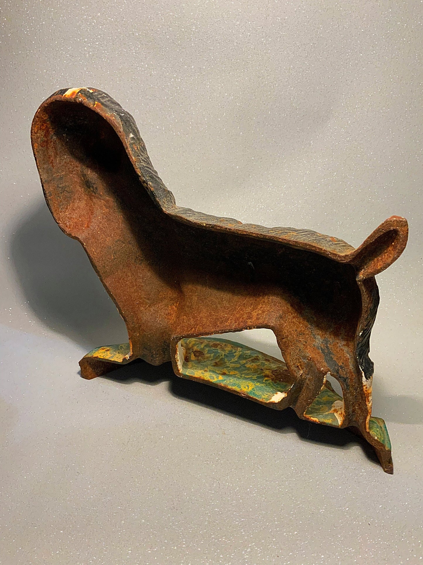 A super antique dog door stop