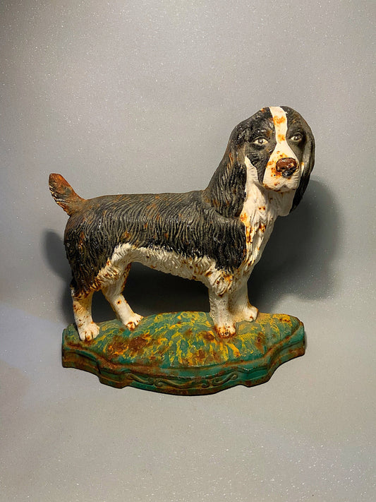 A super antique dog door stop