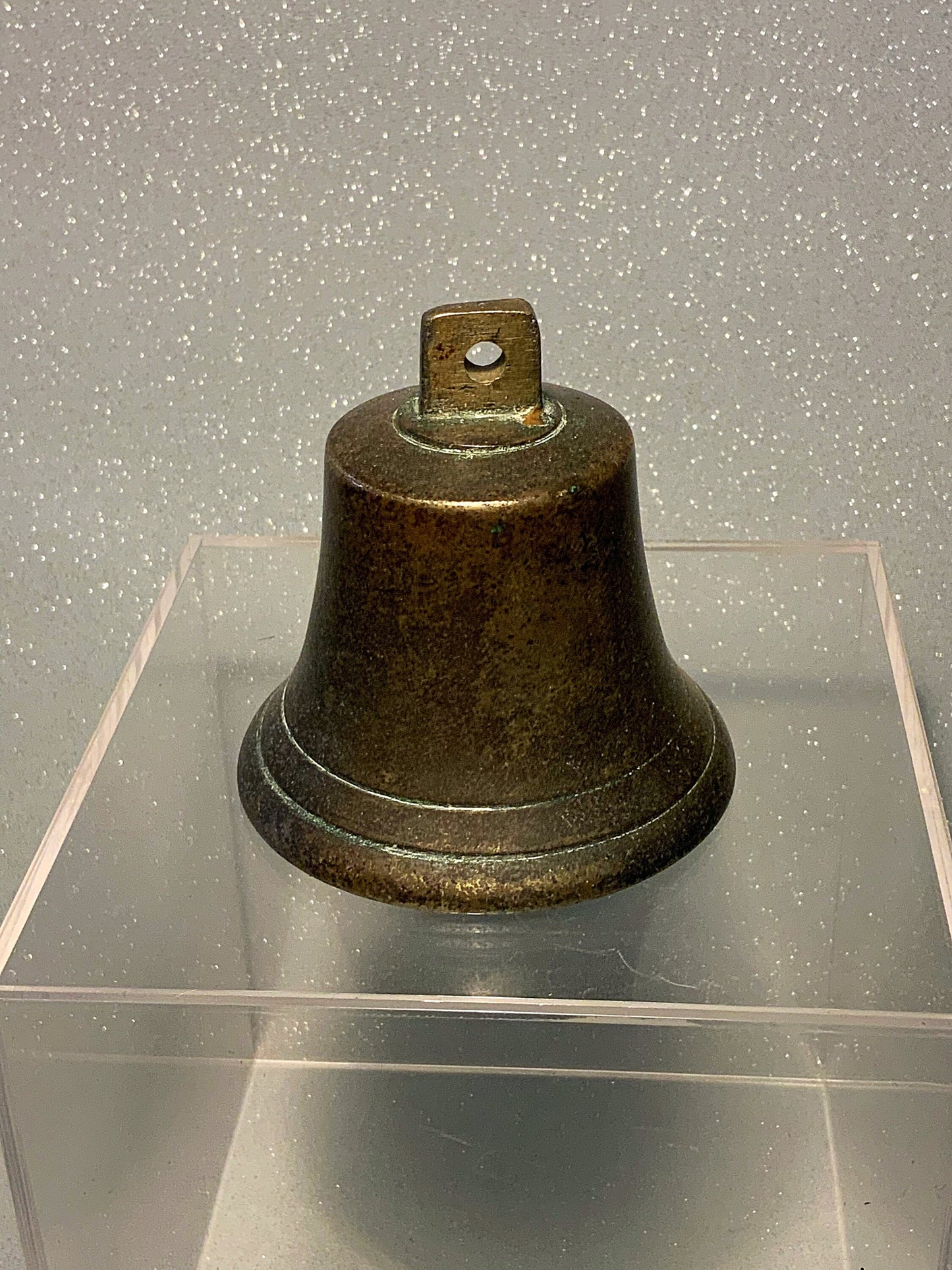 A small  and authentic English antique bronze bell