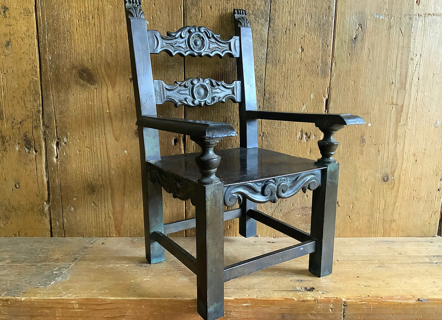 A stunning apprentice or salesman’s bronze thrown or chair