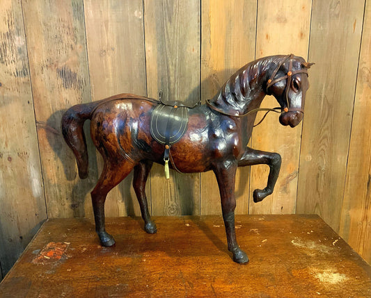 An awesome large vintage leather clad horse