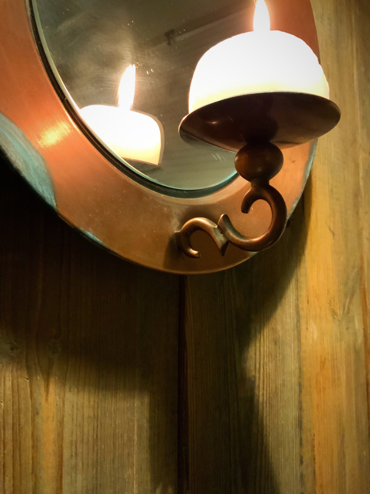 Vintage copper mirror with candle light