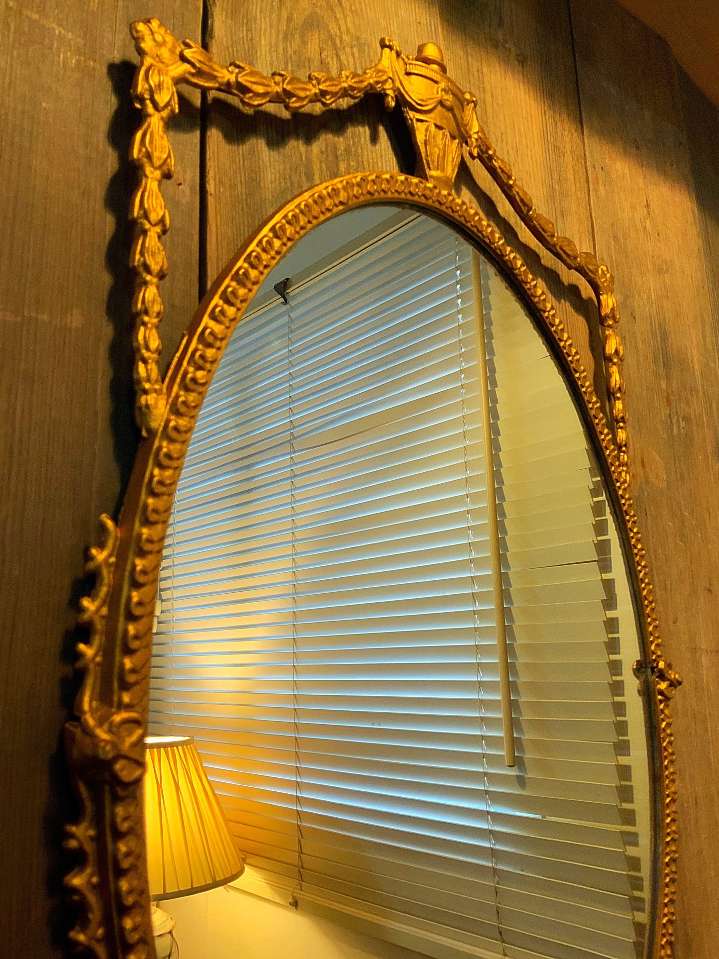 An English gilt and iron regency style mirror