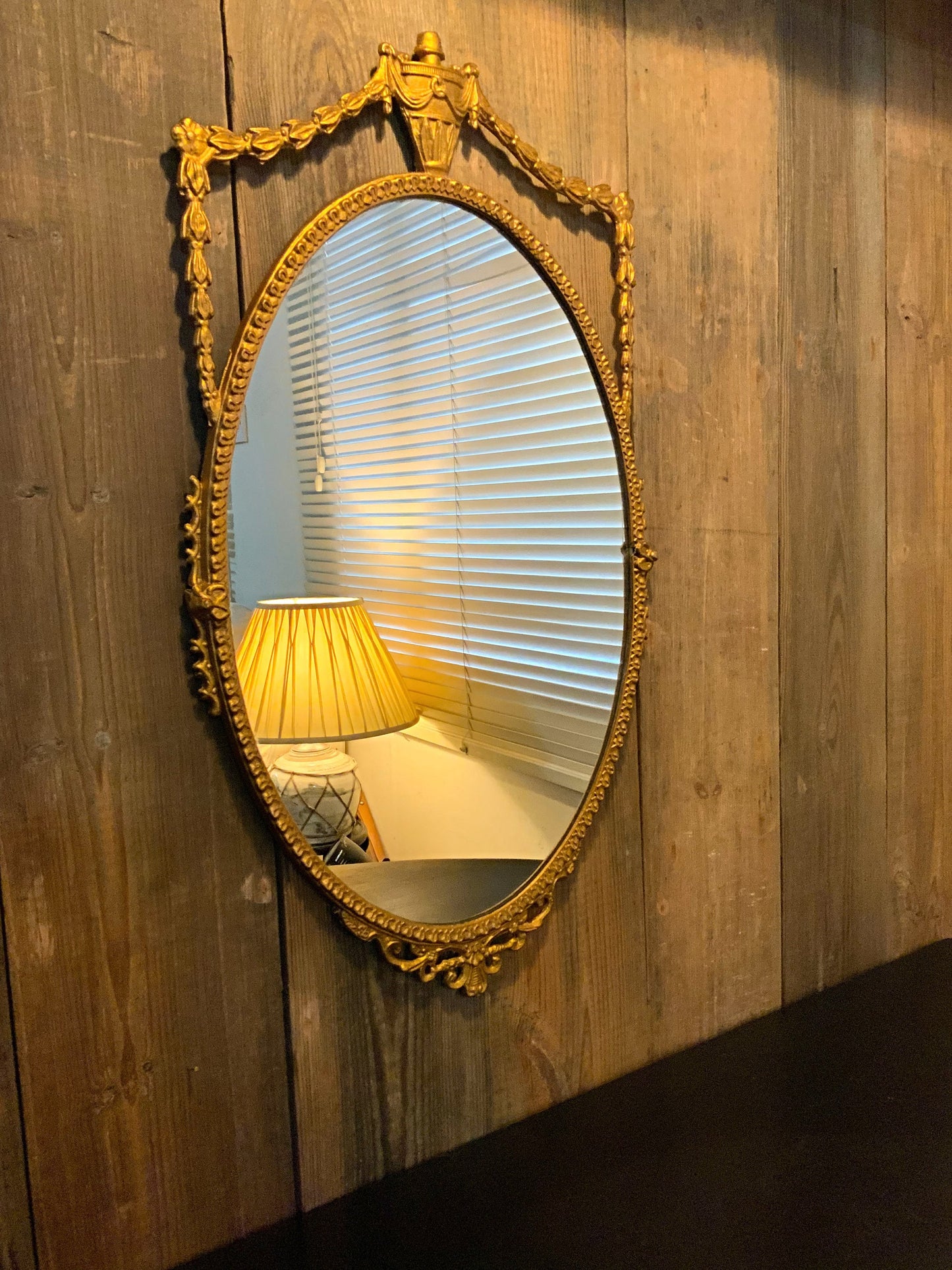 An English gilt and iron regency style mirror