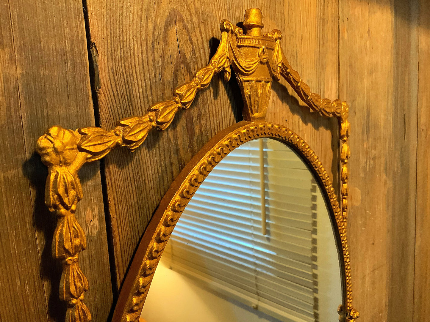 An English gilt and iron regency style mirror