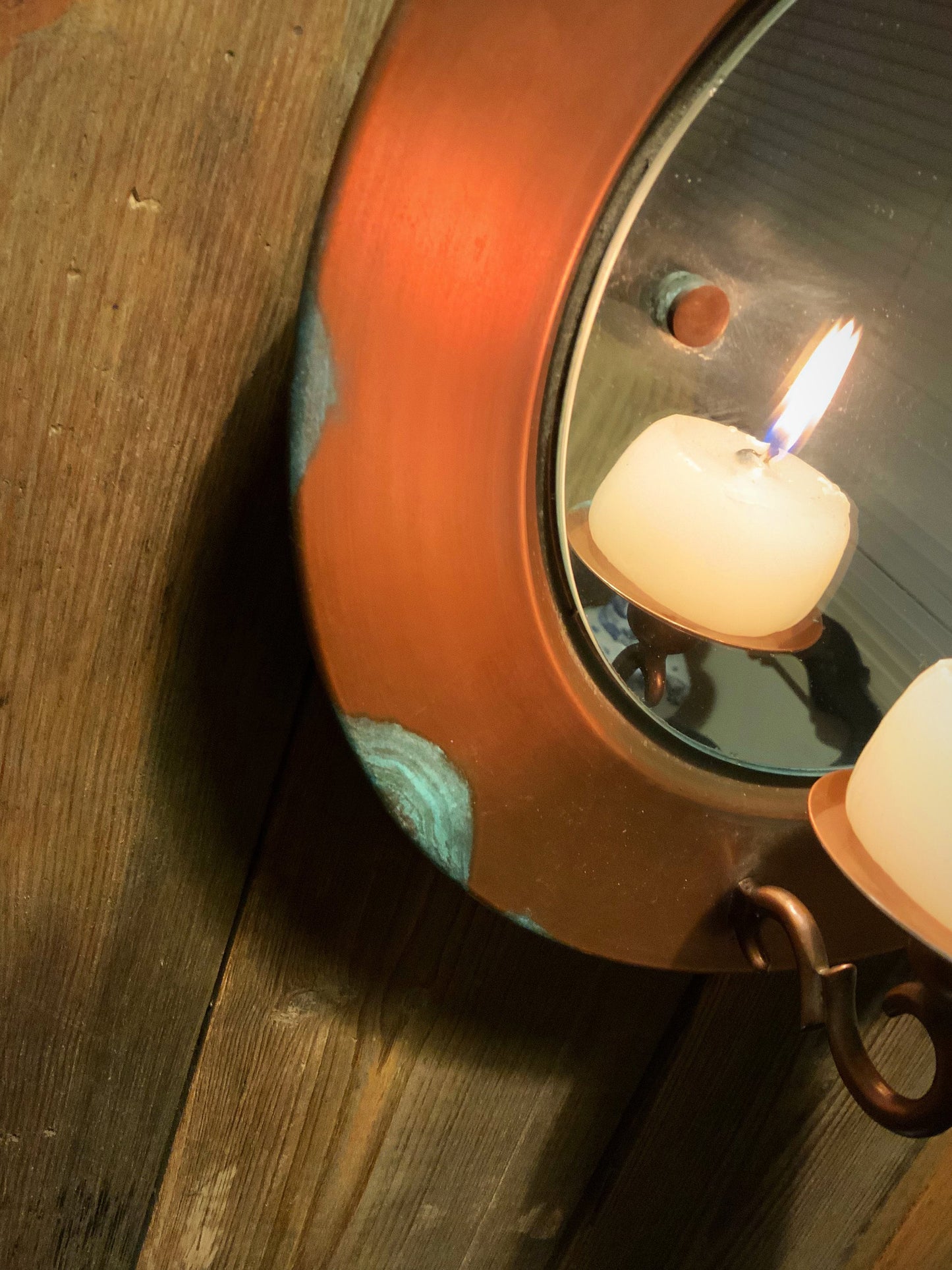 Vintage copper mirror with candle light