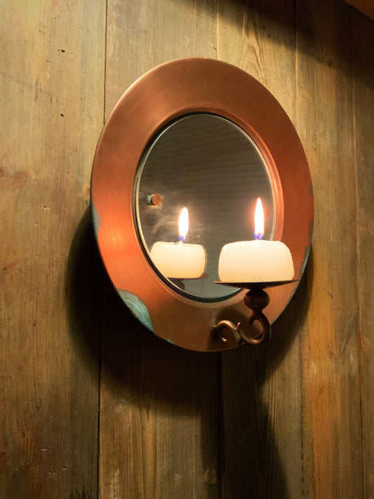 Vintage copper mirror with candle light