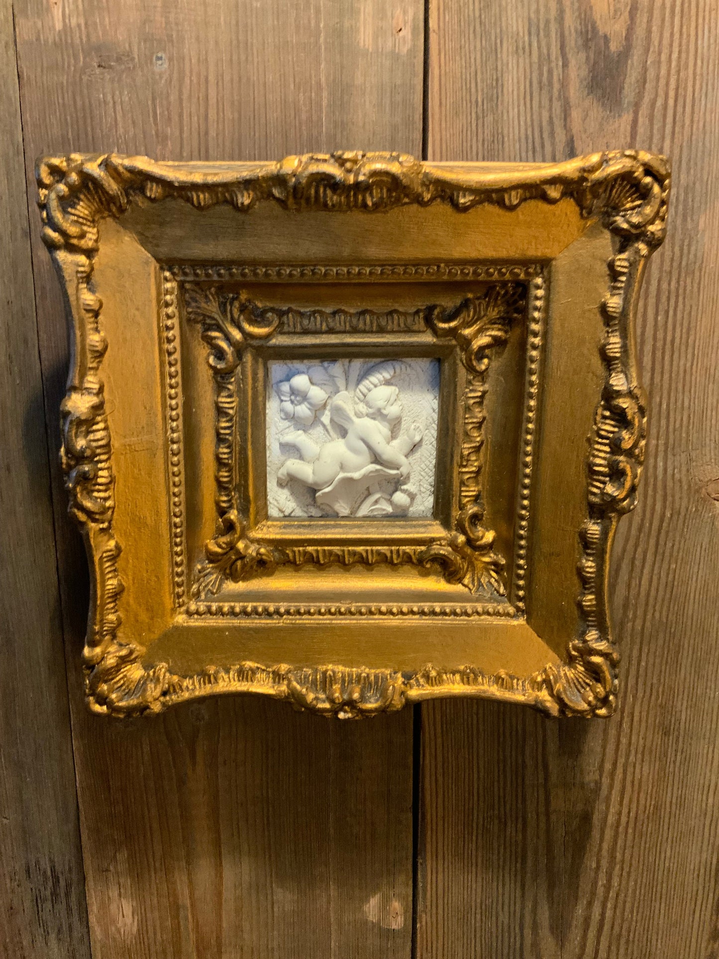 A pair of Italian framed plaques