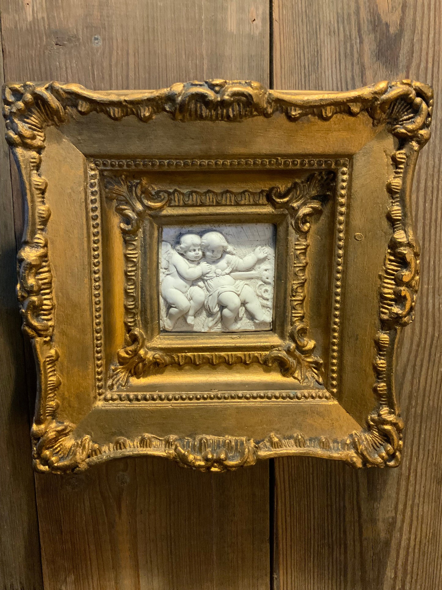 A pair of Italian framed plaques