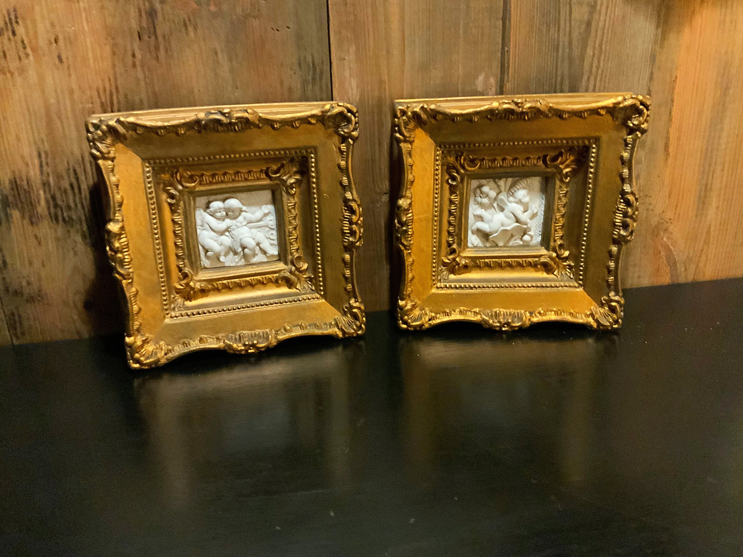 A pair of Italian framed plaques