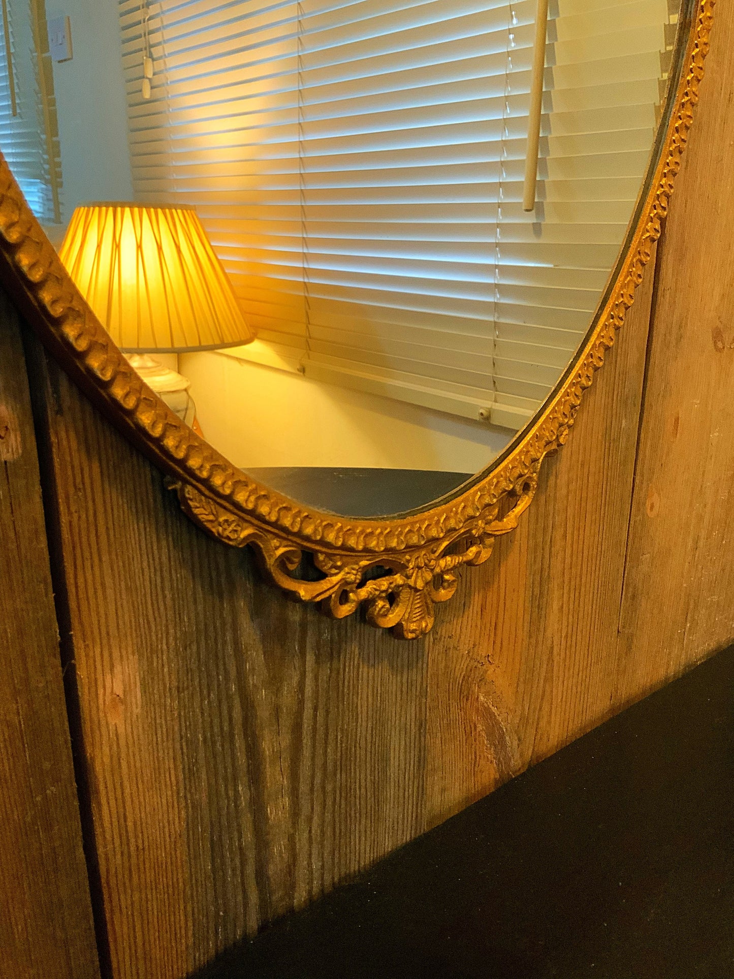 An English gilt and iron regency style mirror