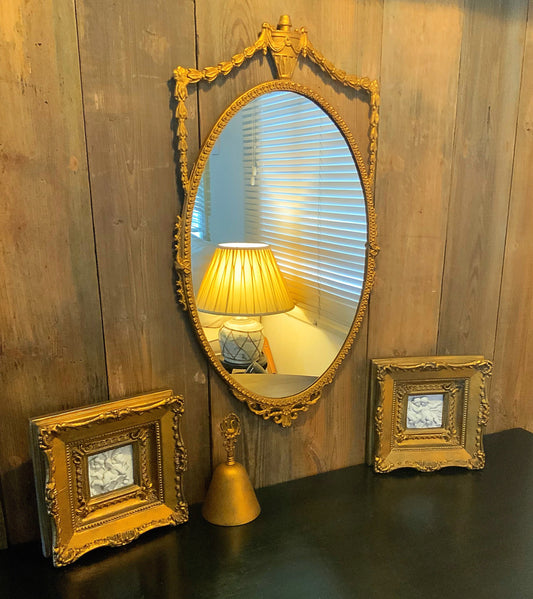 An English gilt and iron regency style mirror